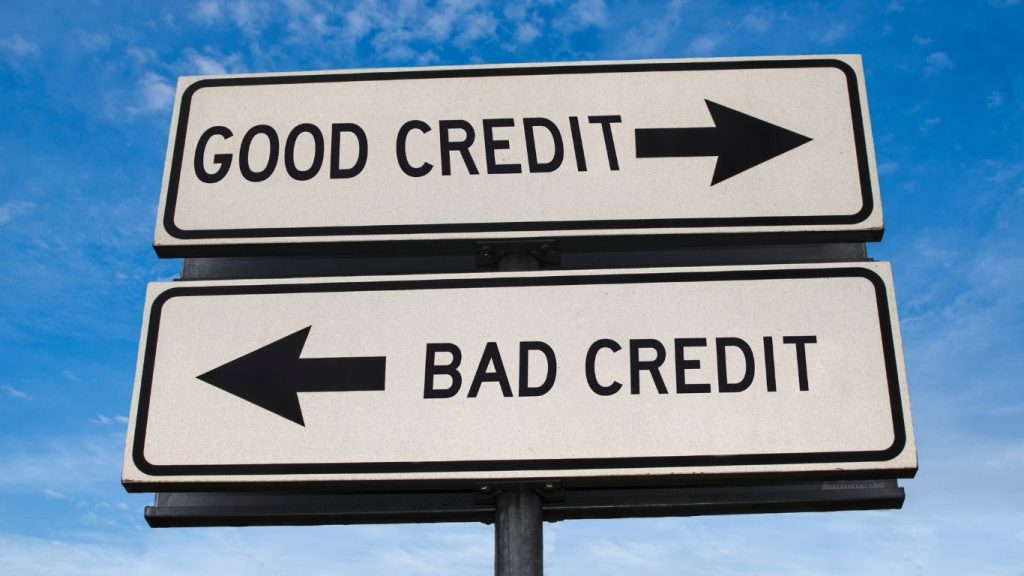 Directional signs pointing to “Good Credit” and “Bad Credit” symbolizing credit score choices and financial decisions.Bad credit repair help.