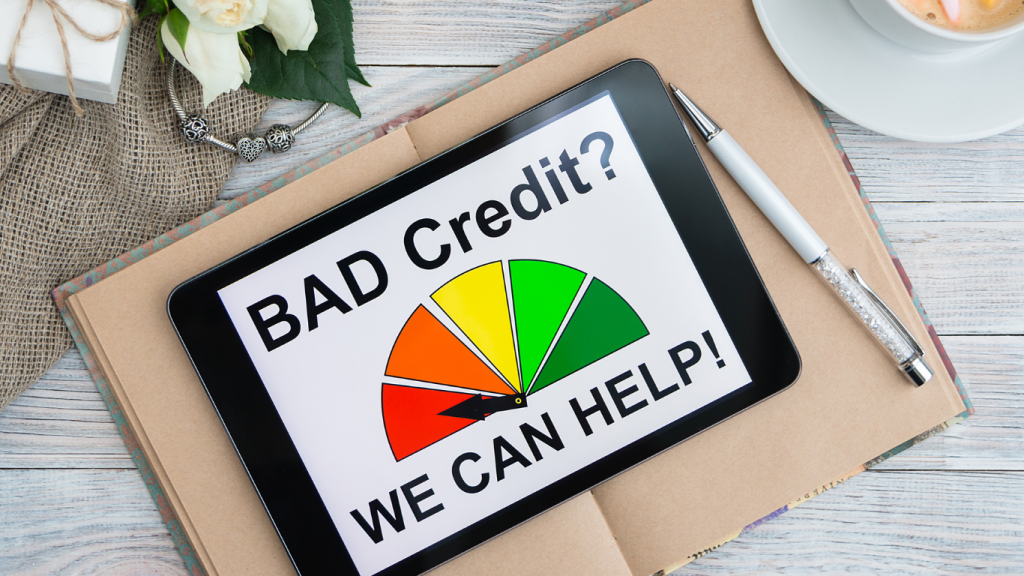 Tablet showing “Bad Credit? We Can Help!” with a credit score gauge, symbolizing credit repair assistance.